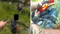 Police lasso chainsaw-wielding man and drag him from pond