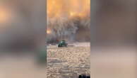 US farmers flee wildfire sparked by dry conditions in dramatic footage