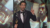 Adrien Brody tosses gum then shushes walk-off music during Oscar win