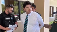 Moment fake nurse is arrested after police lure him to job interview