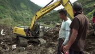 Rescuers remove bodies from hill after fatal landslide Ecuador