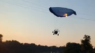 Shocking moment paraglider flies into power lines in North Dakota