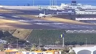 Plane bounces off runway while battling strong winds at airport
