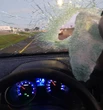 Vrou waag dit nie om te stop toe baksteen op N2 deur voorruit vlieg