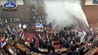 Smoke grenades tossed in Serbian Parliament, lawmaker suffers stroke