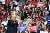 'I took a bullet for democracy,' Trump tells first rally since shooting