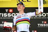 Evenepoel survives fright to win time-trial as Pogacar holds lead