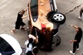 Crowd rescue mother and son trapped in car after crash
