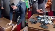 Taliban order ban on smartphones as officials shown destroying devices