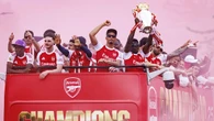 Arsenal fans turn streets red for victory parade