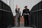 Impromptu walkabout by the King cheers crowds on rainy day