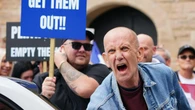 Opposing sides chant and shout outside asylum hotel in Perth