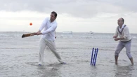 In Pictures: Waterlogged pitch perfect for cricketers playing annual game in sea