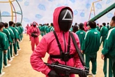 Squid Game creator justifies using children's games for violent show