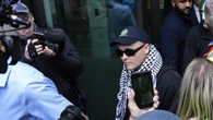Kneecap rapper faces month-long wait over whether terror charge is thrown out