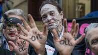 Climate activists in ‘zombie dance’ protest outside insurance offices