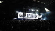 Oasis take to stage for first gig in 16 years to jumping crowd and flying cups