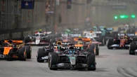 McLaren duo collide on opening lap before George Russell wins Singapore GP