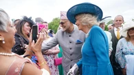 Camilla makes friends with ‘attention-seeking’ guide dog at palace garden party