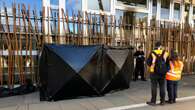 Climate activists clamp themselves to Scottish Parliament building