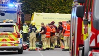 Four injured after car driven at people and man stabbed outside synagogue