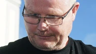 Murder accused cut dressing gown belt so he could hold dead wife, court hears