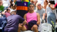 Carlos Alcaraz plays down concerns over knee issue after easing to victory