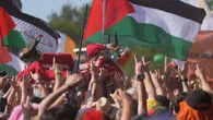 Kneecap and Brian Eno call on artists to join syndicate to support Palestine
