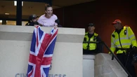 Charges dropped against woman who unfurled flag from Epping council building