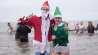 Christmas Day swimmers brave cool sea temperatures for festive dip