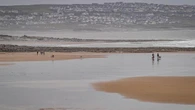 Footage shows rescue of surfer caught in powerful rip current