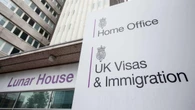 Number of foreign nationals arriving on work visas falls by nearly a half