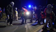 Riot police stop migrants from reaching beach in French town