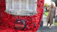 Queen pins final poppy on huge war memorial display