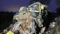 Man and business charged over 27-tonne mound of waste that blocked road