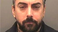 Disgraced rock star Ian Watkins died from stab wound to the neck, inquest hears
