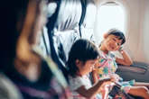 Which airlines let you sit with your child for free and which charge?