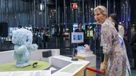 Duchess of Edinburgh interacts with robot dog during Japan visit