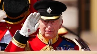 King wears black armband in memory of India air disaster at Trooping the Colour