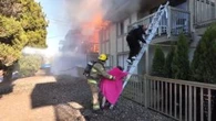 Caught on video: Woman says ‘hero’ helped save her from burning Burnaby building