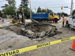 Sinkhole opens at busy Toronto intersection, leading to basement flooding