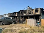 Dog dead, 12 people displaced after fire destroys 2 townhomes in southeast Calgary