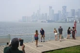 Canadians face air quality, heat warnings as some stuck indoors from both