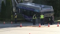 Crash sends bus into front yard in Surrey