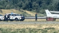Incident at Vancouver airport temporarily halts flights, police seen on runway