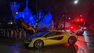 Driver arrested for impaired driving after McLaren crashes into bike station at Casa Loma