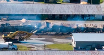 A barn fire at harness racing track kills 17 horses in upstate New York, cause is under investigation