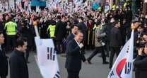 Detained South Korean president is freed to cheers and jeers as he faces insurrection trial