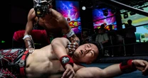With kung fu kicks and dragon masks, pro wrestlers find new fans at fight night in China