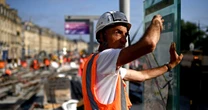 As Europe swelters in extreme heat, Eiffel Tower closes its top level and a Swiss reactor shuts down